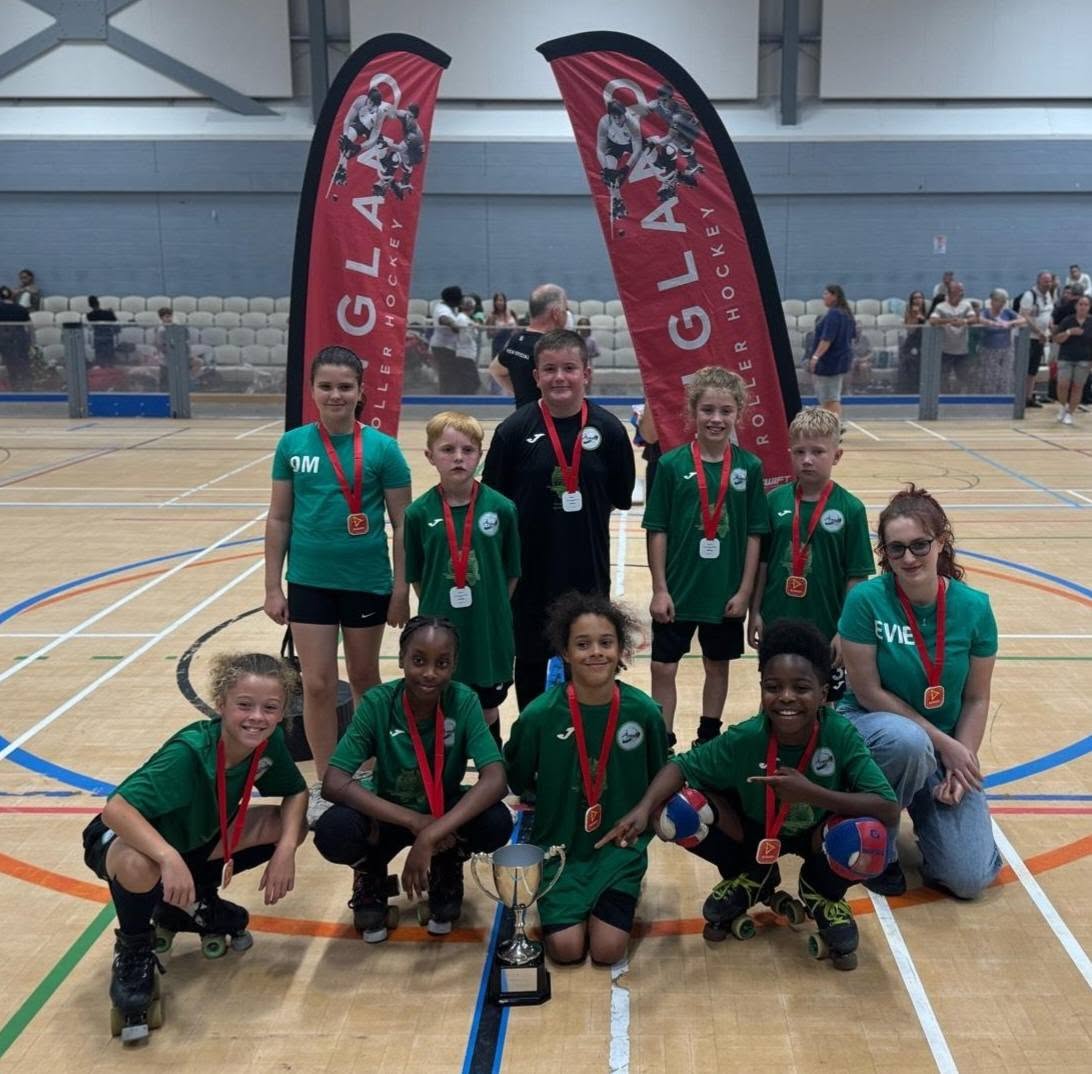 The winning under 13 squad with the league trophy
